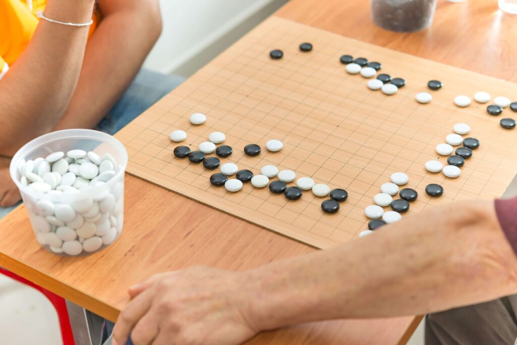 Persatuan Sukan Weiqi Malaysia emblem related to Weiqi (Go) and mind sport events.